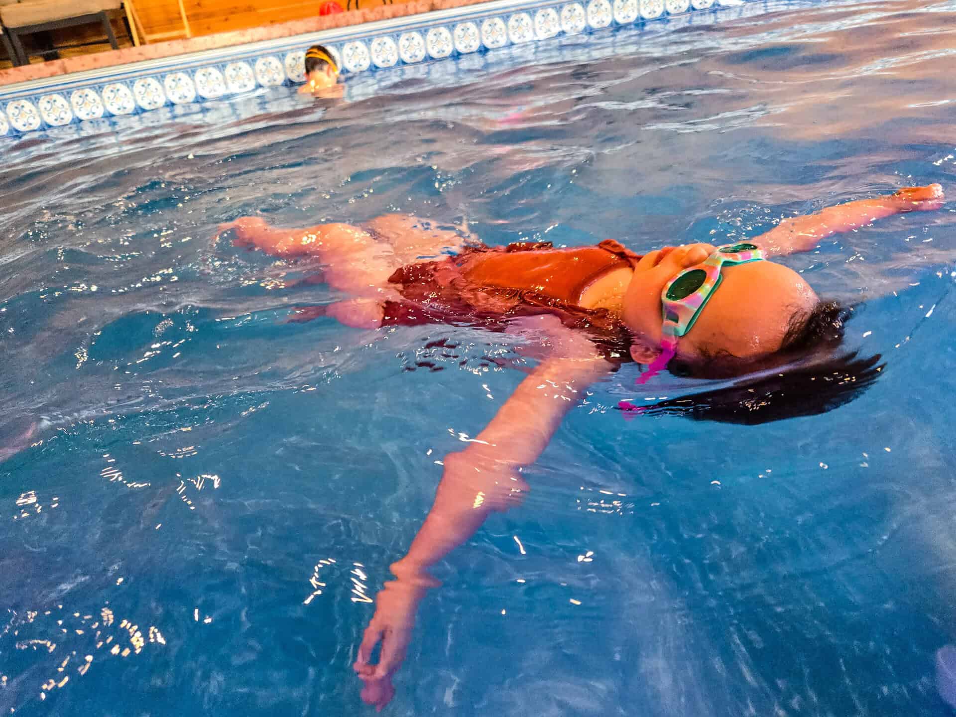 Billings child learning to swim at Barracuda Swim Club
